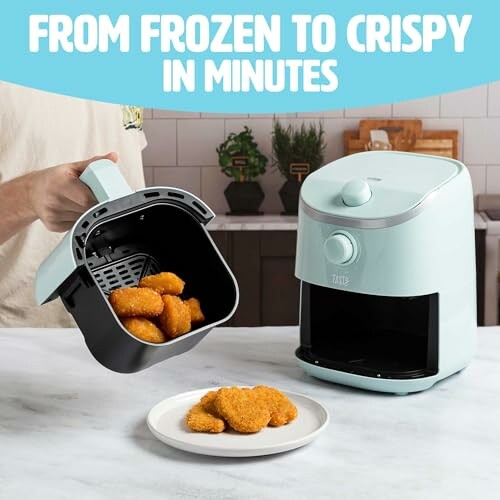 Air fryer with chicken nuggets being served