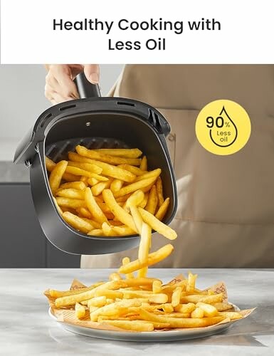 Person pouring fries from an air fryer onto a plate, promoting healthy cooking with less oil.