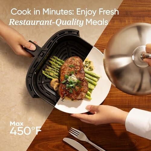 Steak and asparagus in air fryer basket served on plate.