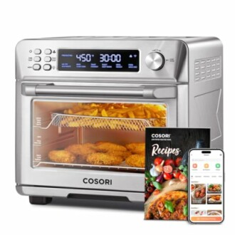 Cosori air fryer toaster oven with digital display and cookbook.