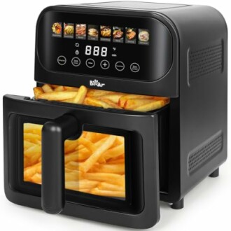 Digital air fryer with fries inside and control panel.