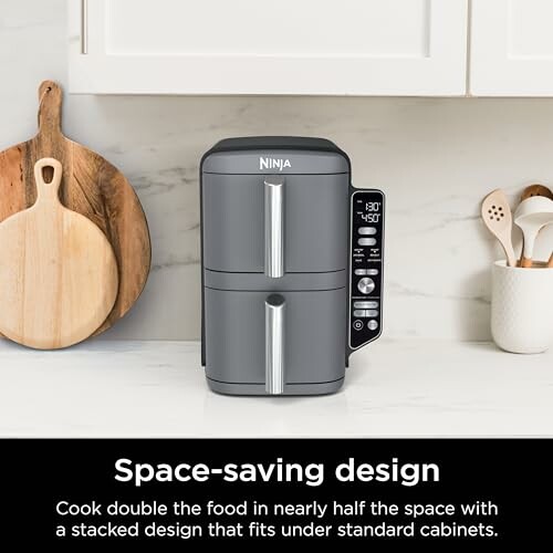 Ninja air fryer with space-saving design on a kitchen counter.