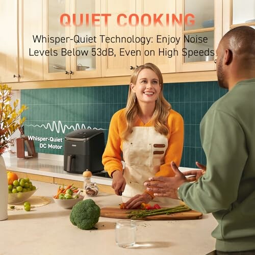 People cooking in a quiet kitchen with whisper-quiet technology.